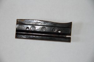Inner side of bakelite handle plate reveals more markings